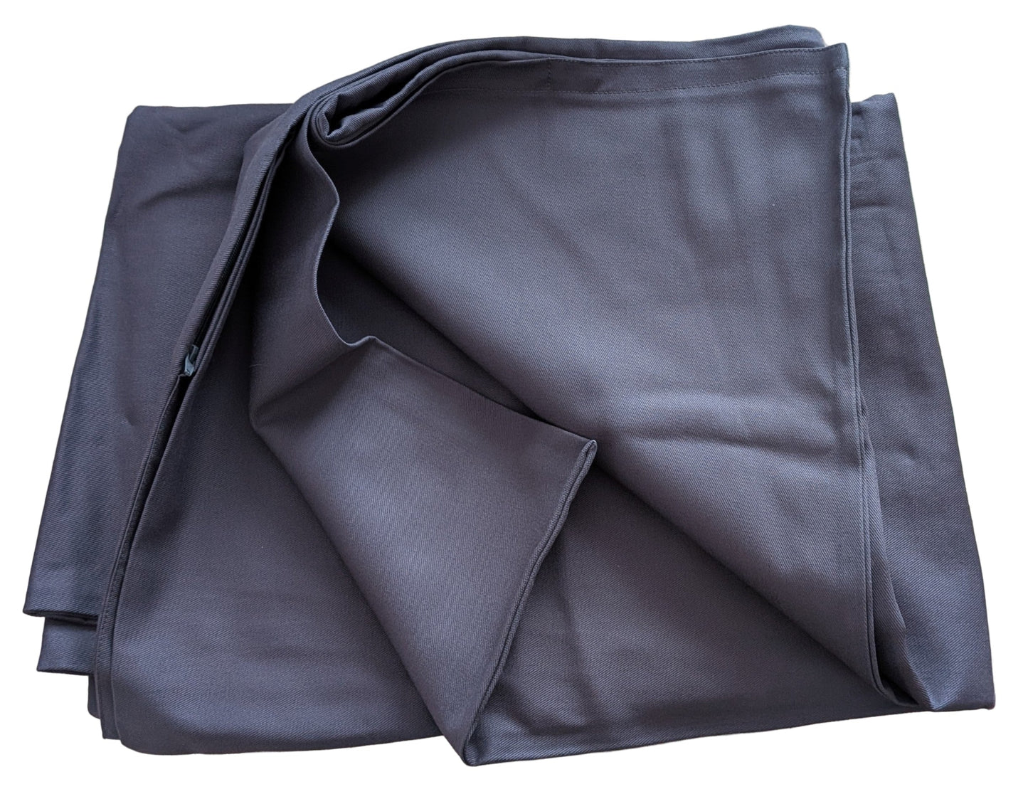 Folded gray fabric on a textured surface