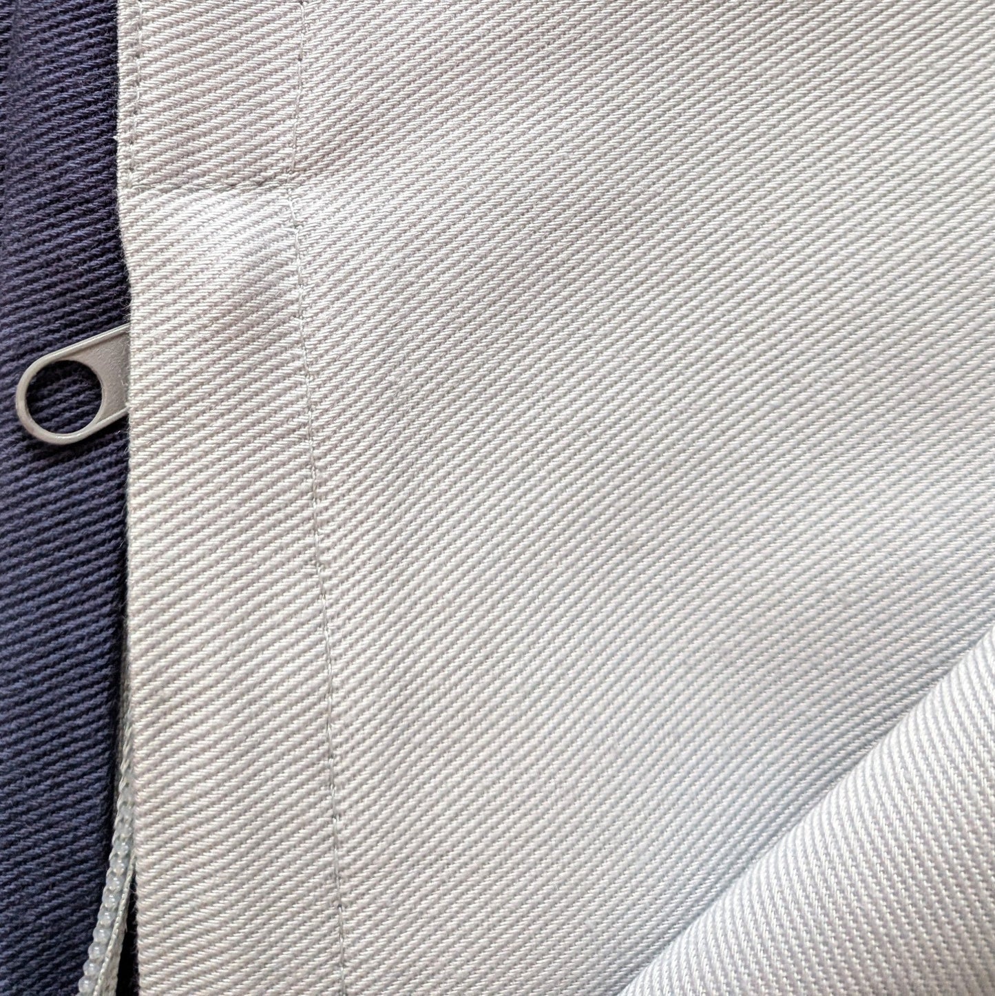 Close-up of fabric texture with a zipper pull