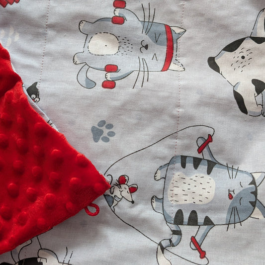 Fabric with cat pattern and red textured corner