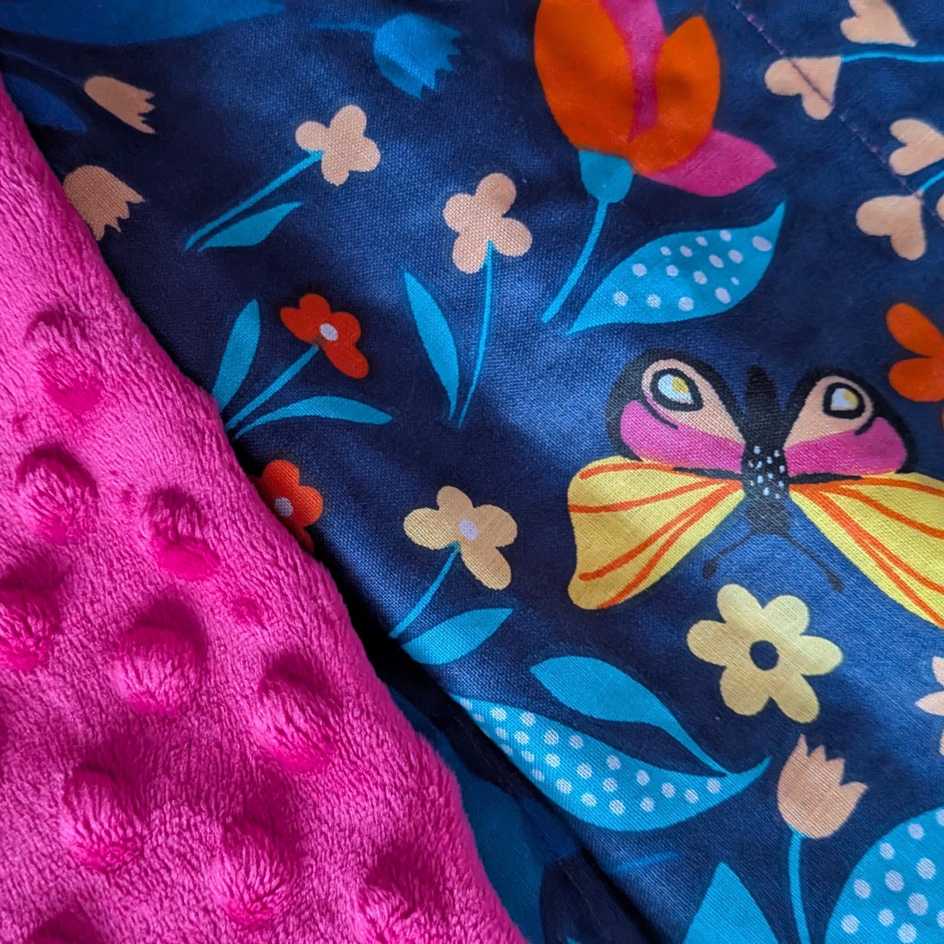 summer meadow pattern and fuchsia minky weighted blanket