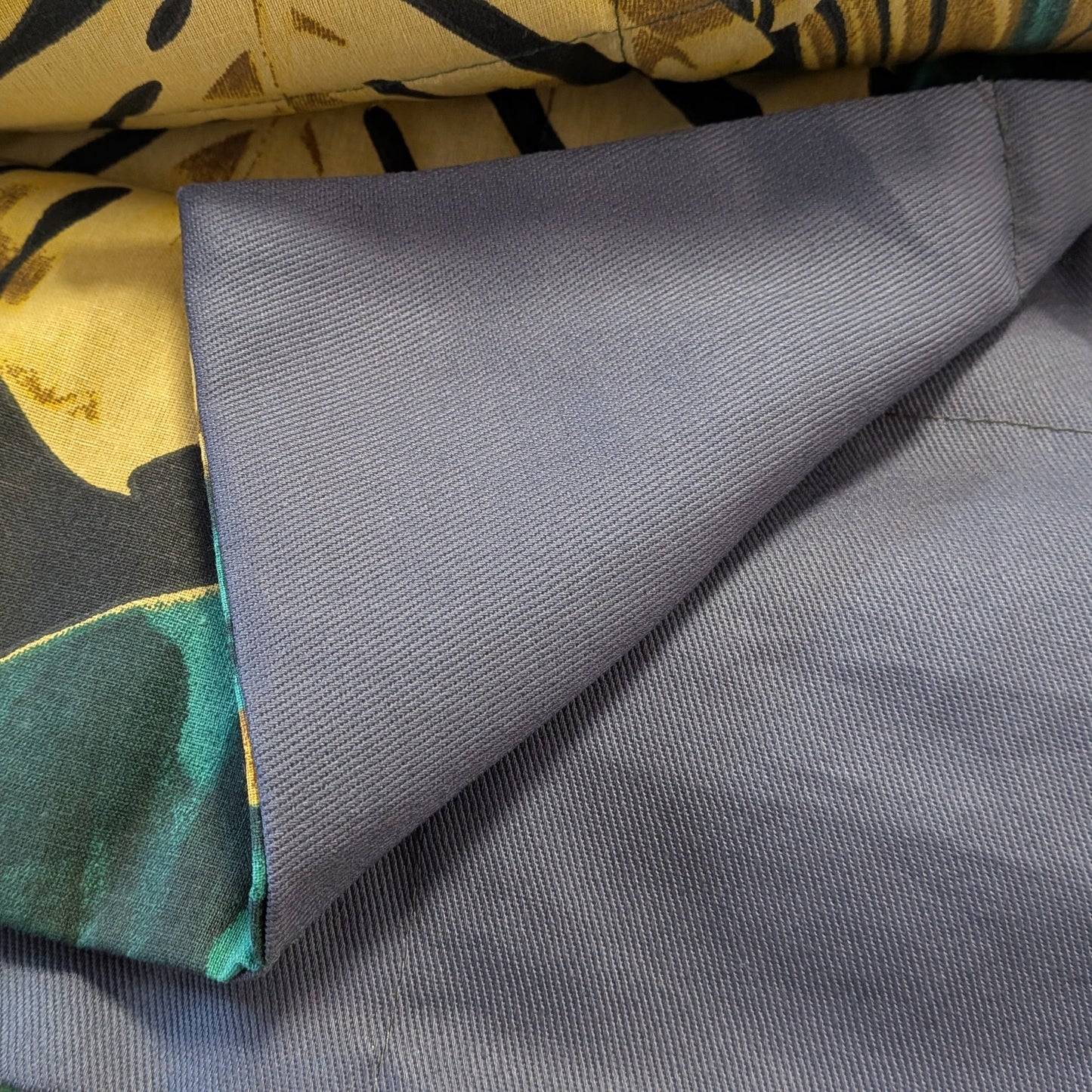 exotic jungle and dark grey weighted blanket close up on the fabric