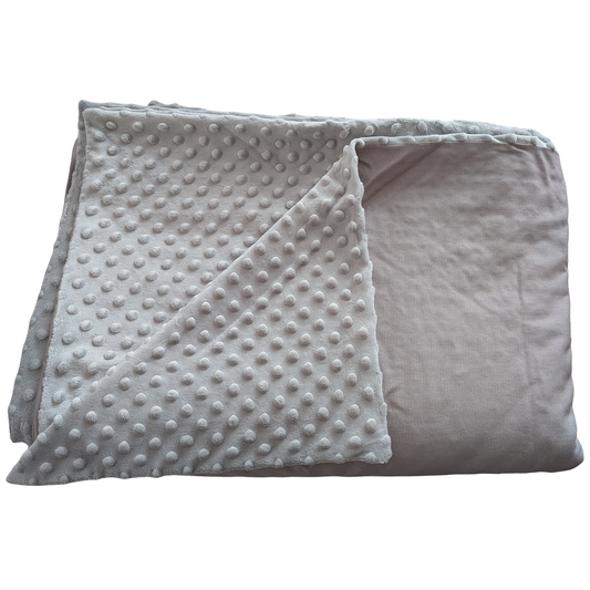 Folded gray blanket on a white background