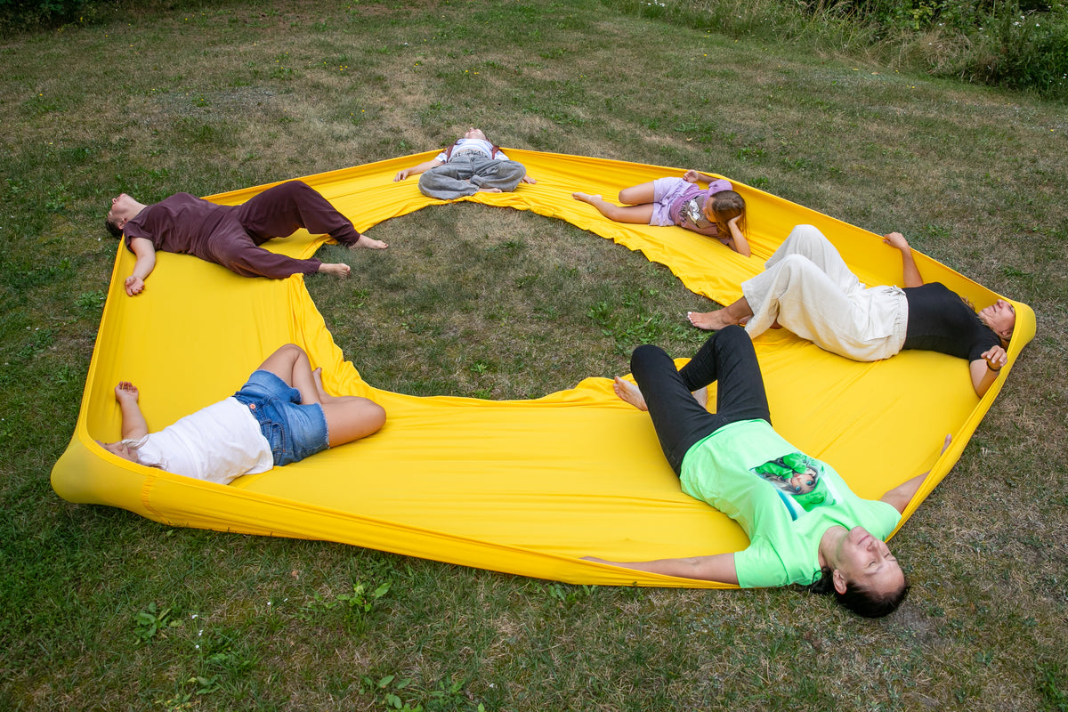 kids relaxing in the yellow flexible circle 