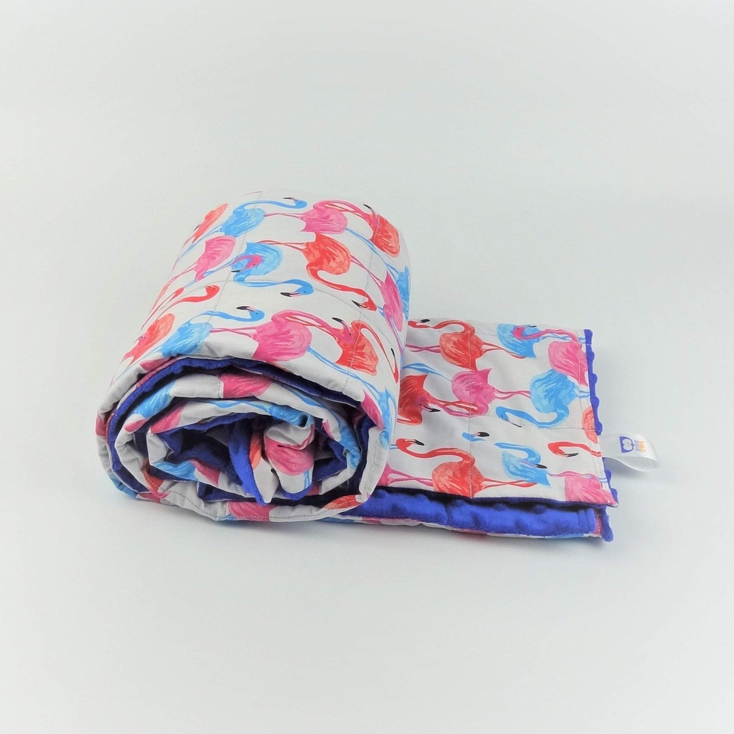 pink, blue and orange flamingo pattern weighted blanket by sensory owl