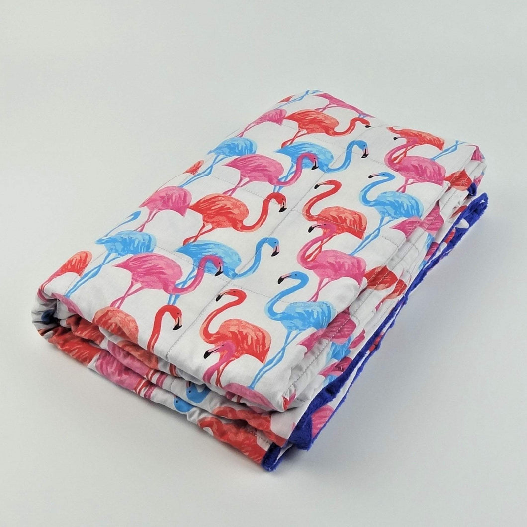 pink, blue and orange flamingo pattern weighted blanket by sensory owl